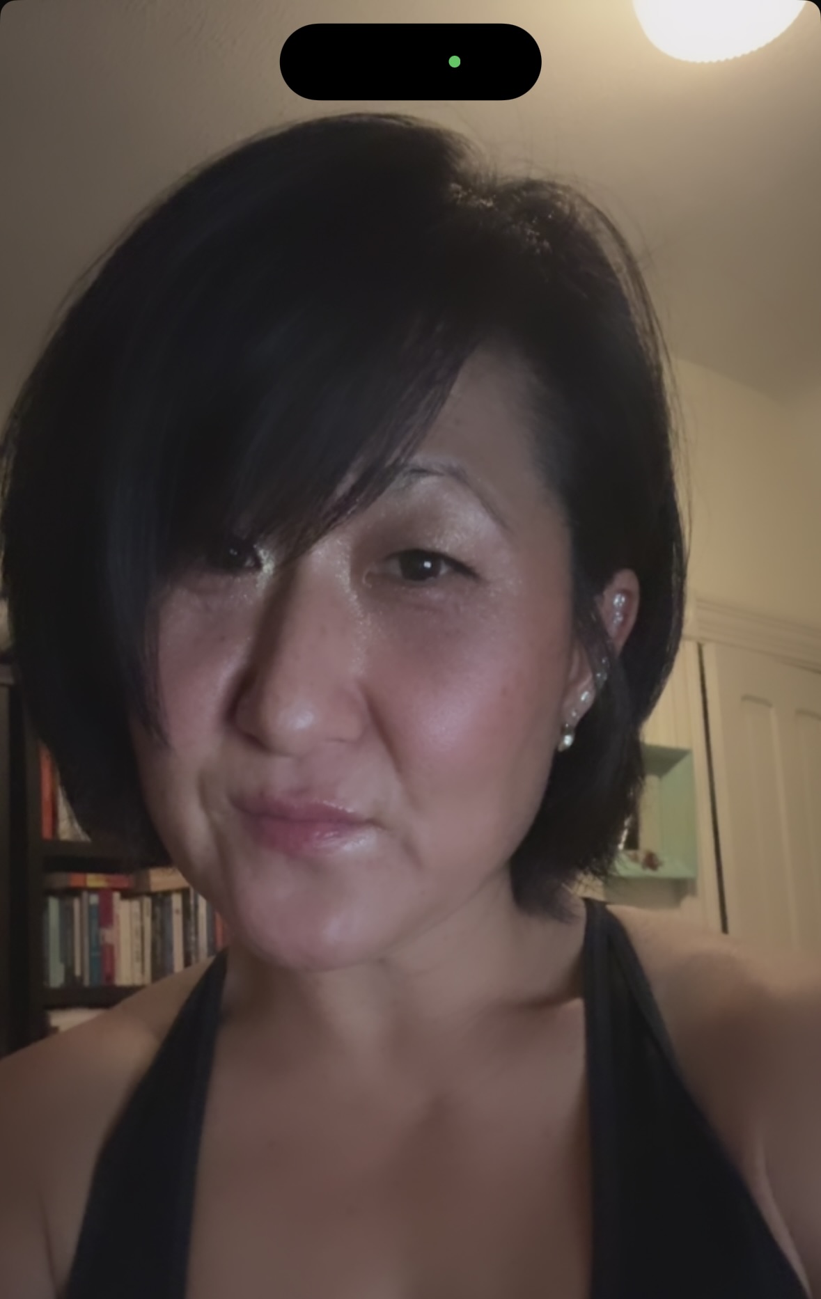 Image of the creator of this page a young Korean women wearing a black tank top.